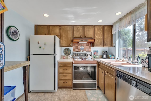 17004 137th Pl SE, Renton, WA 98058 - kitchen with freestanding refrigerator, range with electric cooktop, dishwasher, light countertops, and under cabinet range hood