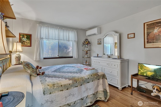 17004 137th Pl SE, Renton, WA 98058 - bedroom featuring a wall mounted air conditioner and light wood-type flooring