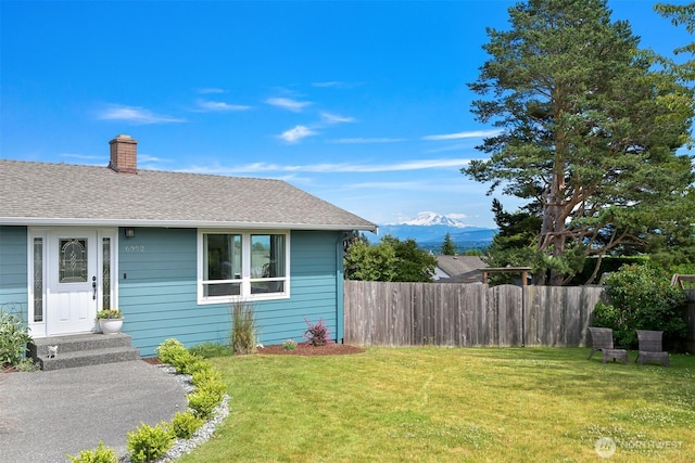 6002 Ridgeview Pl, Ferndale, WA 98248 - view of front of home with a chimney, a mountain view, and a shingled roof
