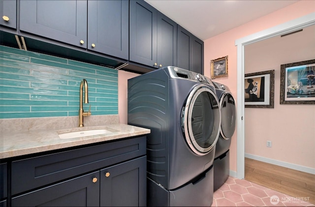 6002 Ridgeview Pl, Ferndale, WA 98248 - laundry area featuring cabinet space, separate washer and dryer, and light wood-type flooring