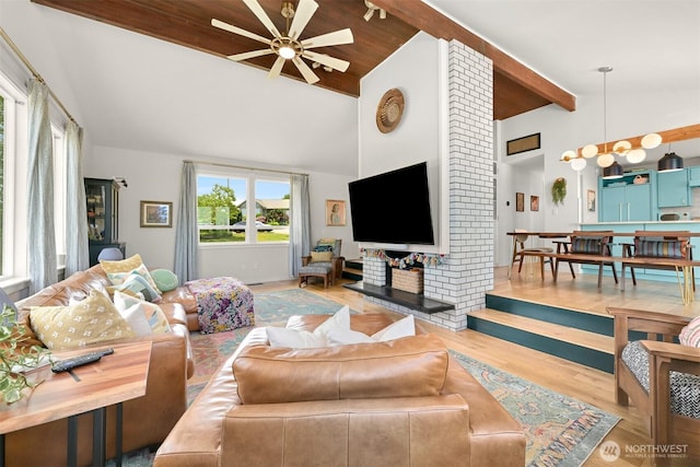 6002 Ridgeview Pl, Ferndale, WA 98248 - living room featuring a ceiling fan, wood finished floors, beamed ceiling, and high vaulted ceiling