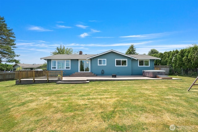 6002 Ridgeview Pl, Ferndale, WA 98248 - rear view of house featuring a hot tub, a fenced backyard, a deck, and a chimney