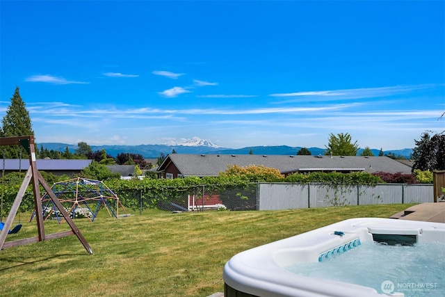 6002 Ridgeview Pl, Ferndale, WA 98248 - view of yard featuring a hot tub, a mountain view, and a playground