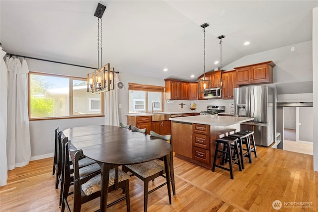 922 SW 160th St, Burien, WA 98166 - dining space featuring vaulted ceiling, light wood finished floors, a chandelier, and recessed lighting