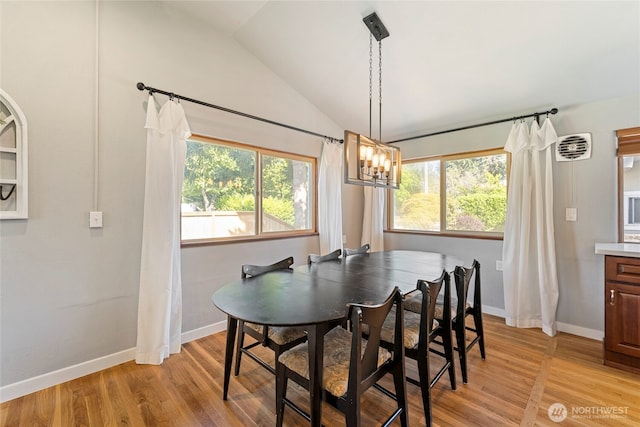 922 SW 160th St, Burien, WA 98166 - dining space featuring vaulted ceiling, light wood-style flooring, and a chandelier