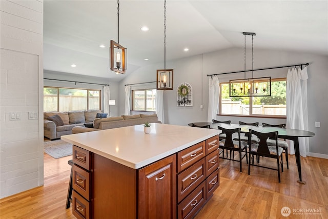 922 SW 160th St, Burien, WA 98166 - kitchen featuring vaulted ceiling, light wood-style flooring, light countertops, a center island, and recessed lighting