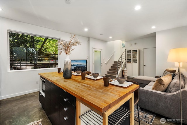 1804 25th Ave Unit A, Seattle, WA 98122 - living room with recessed lighting, stairs, and concrete floors