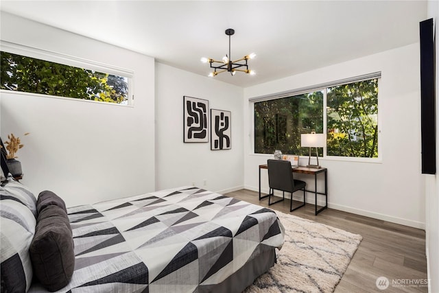 1804 25th Ave Unit A, Seattle, WA 98122 - bedroom featuring a chandelier and wood finished floors