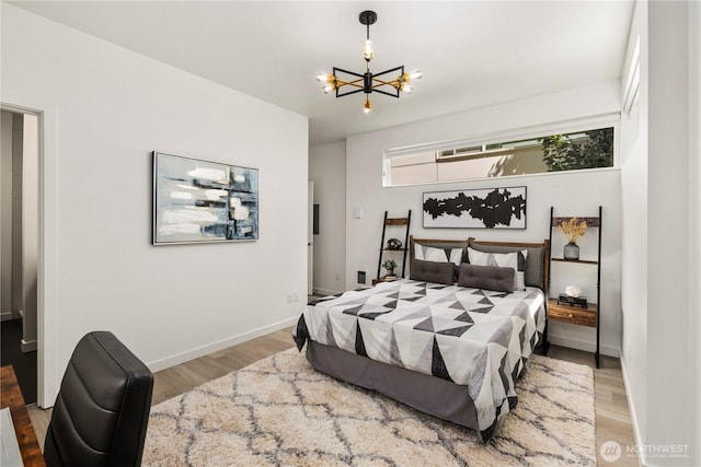 1804 25th Ave Unit A, Seattle, WA 98122 - bedroom featuring a chandelier and wood finished floors