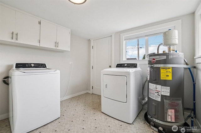 1022 N Anderson St, Tacoma, WA 98406 - washroom featuring water heater, washer and clothes dryer, cabinet space, and light flooring