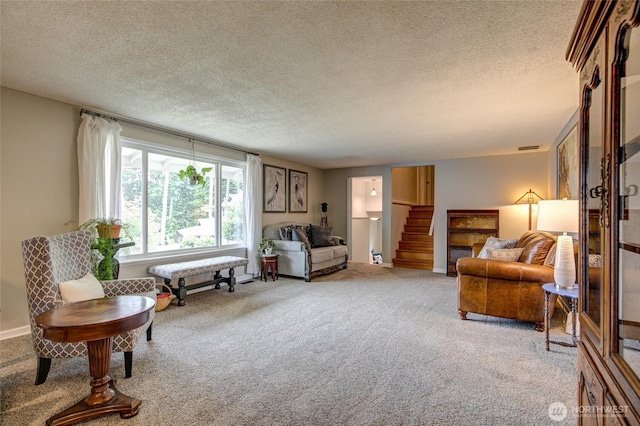 717 Judith Ct, Aberdeen, WA 98520 - living area featuring carpet floors, a textured ceiling, and stairs
