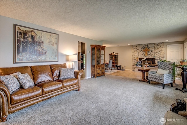 717 Judith Ct, Aberdeen, WA 98520 - living area featuring carpet, a textured ceiling, and a fireplace