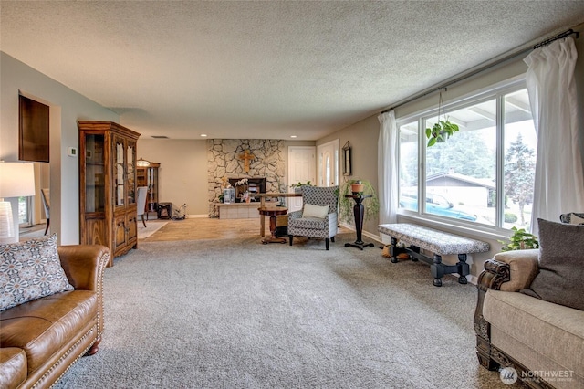 717 Judith Ct, Aberdeen, WA 98520 - living room with a textured ceiling, carpet flooring, and a fireplace