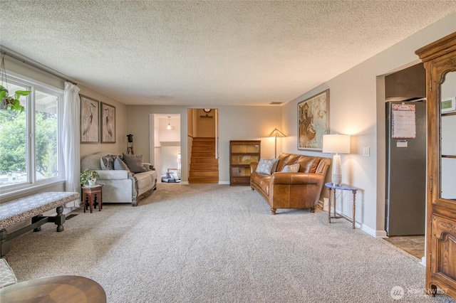 717 Judith Ct, Aberdeen, WA 98520 - living room with light carpet, stairs, and a textured ceiling