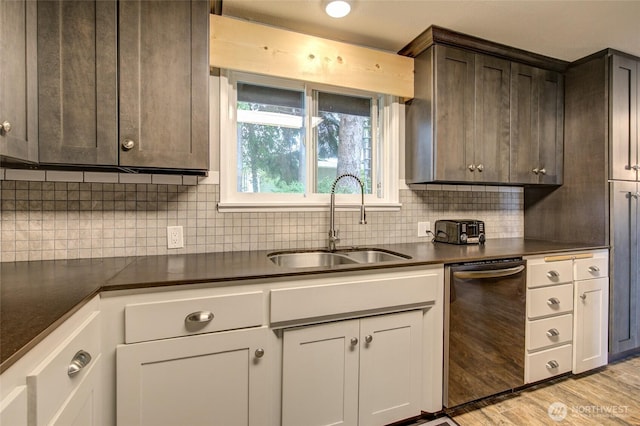 717 Judith Ct, Aberdeen, WA 98520 - kitchen with stainless steel dishwasher, dark countertops, dark brown cabinets, and tasteful backsplash