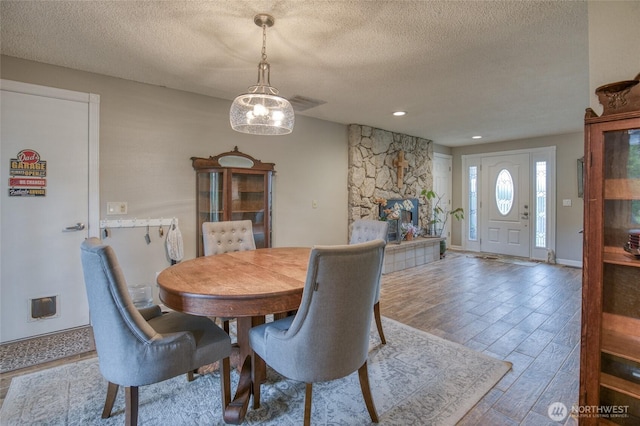 717 Judith Ct, Aberdeen, WA 98520 - dining area with a textured ceiling and wood finished floors
