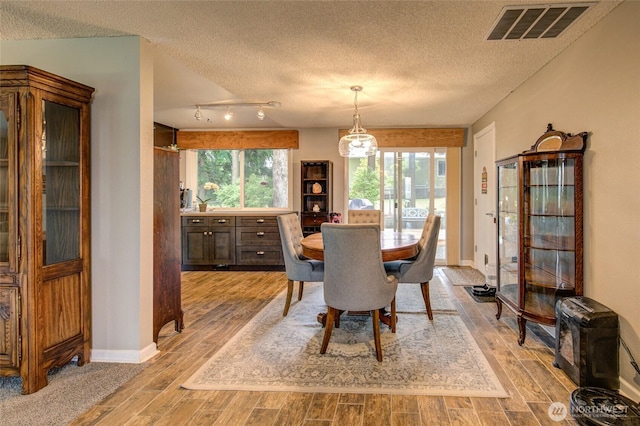 717 Judith Ct, Aberdeen, WA 98520 - dining room with a textured ceiling and light wood-type flooring