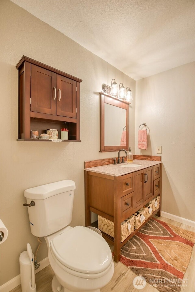 717 Judith Ct, Aberdeen, WA 98520 - bathroom with vanity, wood finished floors, and a textured ceiling