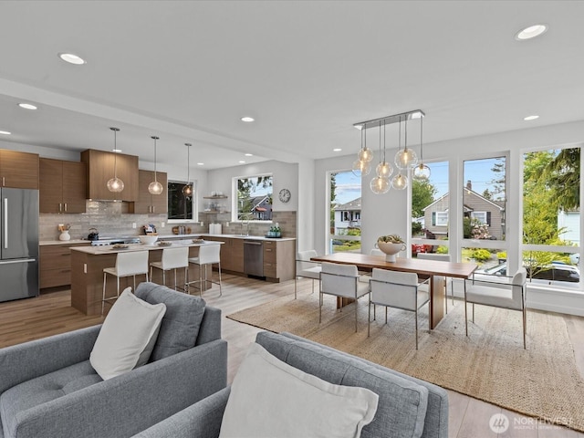 9015 Dibble Ave NW, Seattle, WA 98117 - living room with light wood-style flooring and recessed lighting