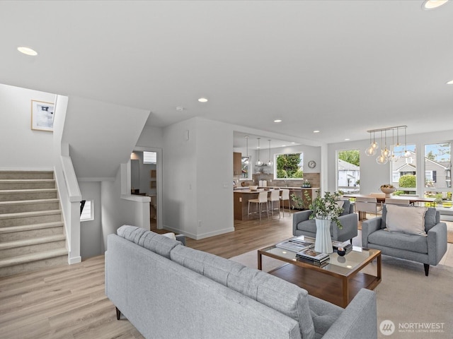9015 Dibble Ave NW, Seattle, WA 98117 - living area with stairs, light wood finished floors, recessed lighting, and a chandelier