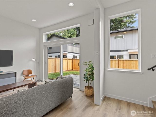 9015 Dibble Ave NW, Seattle, WA 98117 - living room featuring wood finished floors and recessed lighting