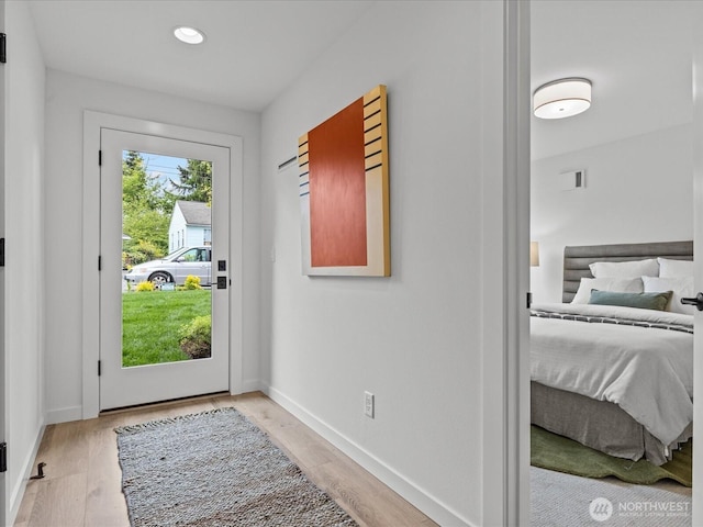 9015 Dibble Ave NW, Seattle, WA 98117 - doorway to outside featuring light wood finished floors and recessed lighting