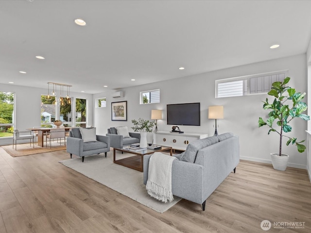 9015 Dibble Ave NW, Seattle, WA 98117 - living room featuring a wall mounted air conditioner, light wood-type flooring, and recessed lighting
