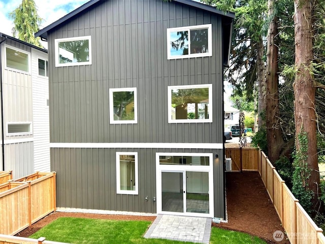 9015 Dibble Ave NW, Seattle, WA 98117 - back of property with a fenced backyard and board and batten siding