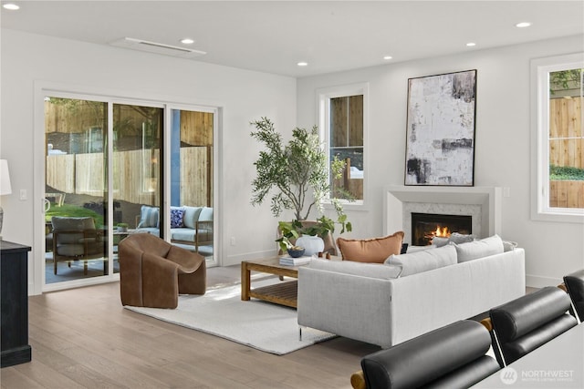 331 18th Ave, Kirkland, WA 98033 - living room featuring wood finished floors, a lit fireplace, and recessed lighting