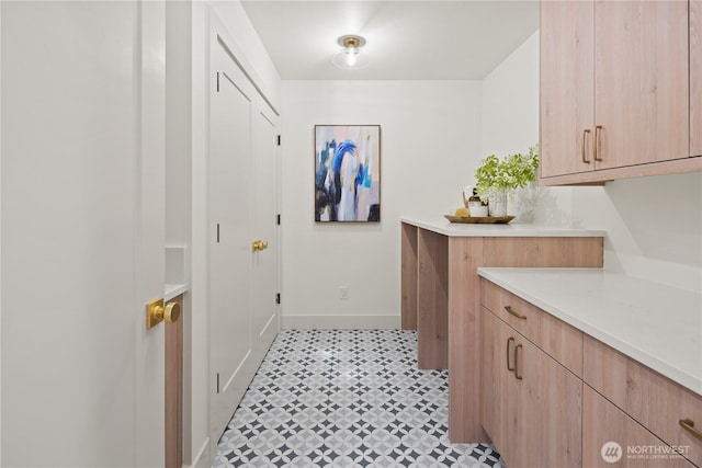 331 18th Ave, Kirkland, WA 98033 - laundry room with baseboards and light tile patterned floors