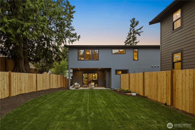 331 18th Ave, Kirkland, WA 98033 - back of house at dusk with a patio and a fenced backyard
