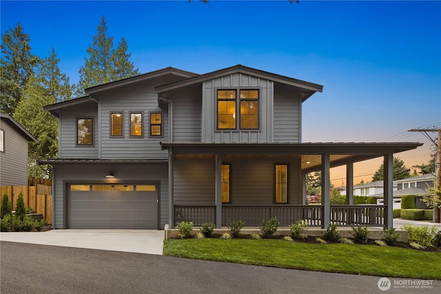 331 18th Ave, Kirkland, WA 98033 - view of front of home with covered porch, board and batten siding, concrete driveway, and an attached garage