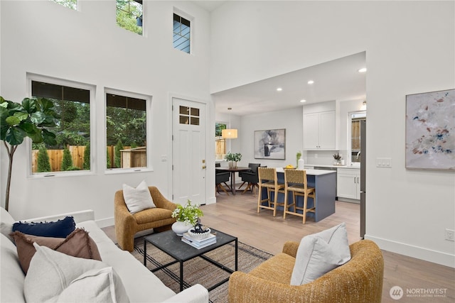 333 18th Ave, Kirkland, WA 98033 - living area with light wood-type flooring, plenty of natural light, a towering ceiling, and recessed lighting