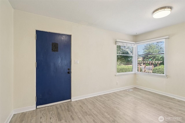 11303 Park Ave S, Tacoma, WA 98444 - unfurnished room featuring wood finished floors and baseboards