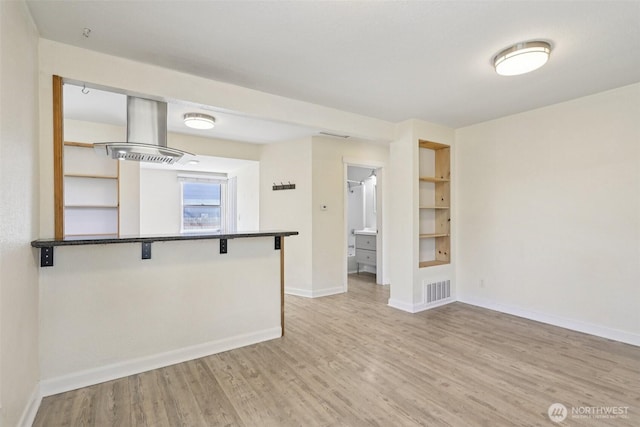 11303 Park Ave S, Tacoma, WA 98444 - empty room featuring wood finished floors and built in features