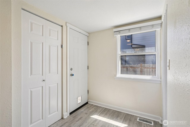 11303 Park Ave S, Tacoma, WA 98444 - unfurnished bedroom with wood finished floors and a closet