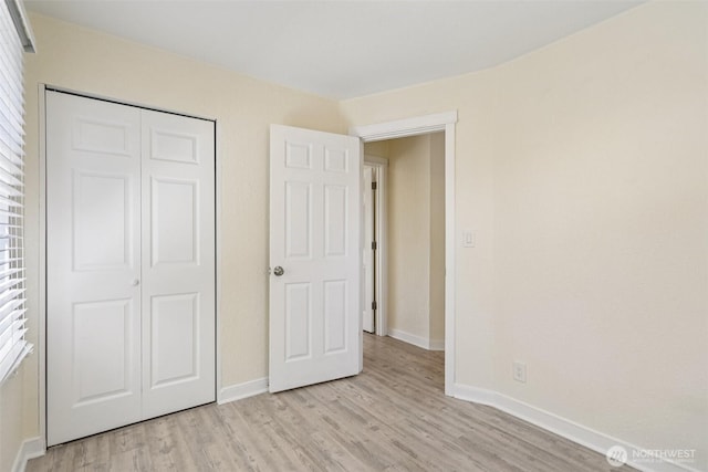 11303 Park Ave S, Tacoma, WA 98444 - unfurnished bedroom featuring light wood-type flooring and a closet