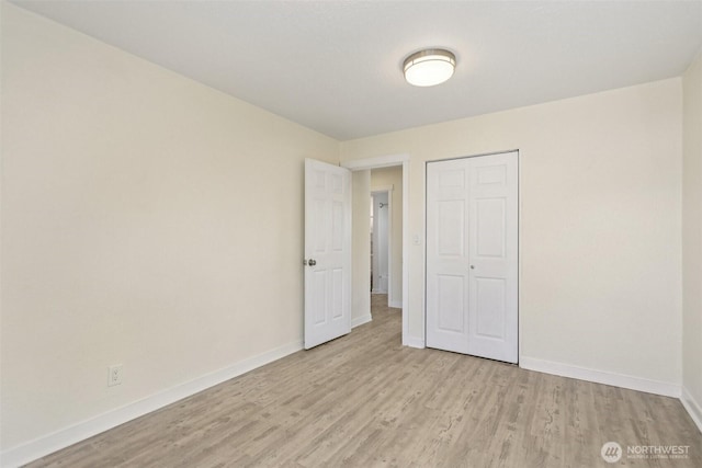 11303 Park Ave S, Tacoma, WA 98444 - unfurnished bedroom with light wood-style flooring and a closet
