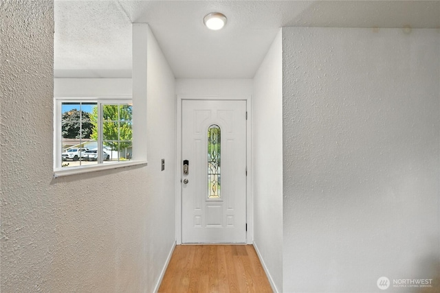 2102 35th Ave, Longview, WA 98632 - doorway to outside with wood finished floors and a textured wall