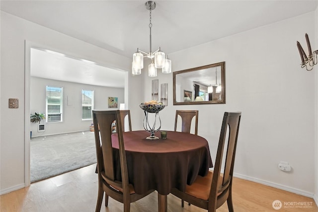 2102 35th Ave, Longview, WA 98632 - dining space with a chandelier and baseboards