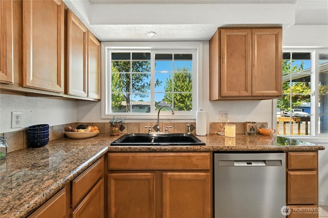2102 35th Ave, Longview, WA 98632 - kitchen with dishwasher, healthy amount of natural light, brown cabinets, and dark stone countertops