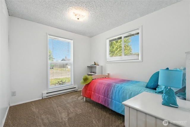 2102 35th Ave, Longview, WA 98632 - carpeted bedroom featuring baseboard heating and a textured ceiling