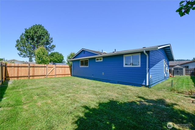 2102 35th Ave, Longview, WA 98632 - rear view of property with a fenced backyard and a storage unit