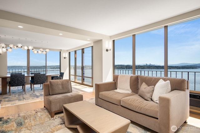 1620 43rd Ave E Unit 15A-B, Seattle, WA 98112 - living room featuring light wood-style floors, a water view, and recessed lighting