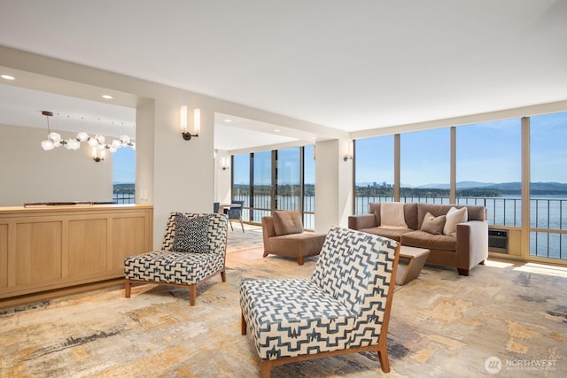 1620 43rd Ave E Unit 15A-B, Seattle, WA 98112 - living area with a water view, a chandelier, and recessed lighting