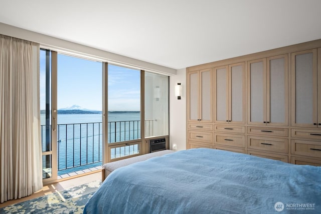 1620 43rd Ave E Unit 15A-B, Seattle, WA 98112 - bedroom featuring a water view and access to outside
