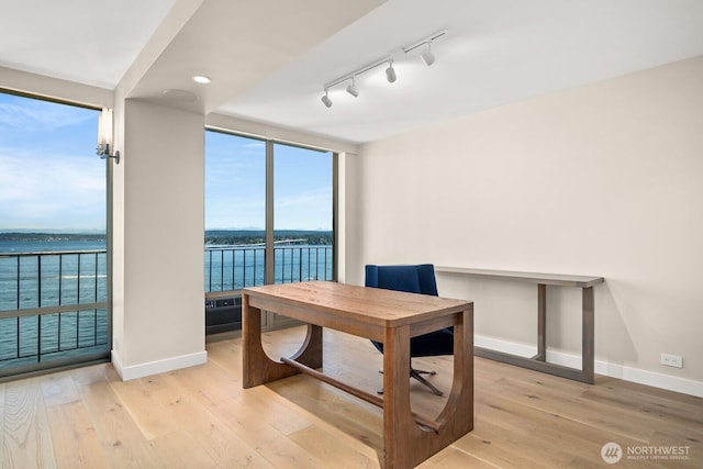 1620 43rd Ave E Unit 15A-B, Seattle, WA 98112 - office space featuring floor to ceiling windows, light wood-style floors, a water view, and track lighting