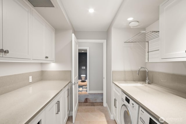 1620 43rd Ave E Unit 15A-B, Seattle, WA 98112 - laundry room featuring washer / dryer and recessed lighting