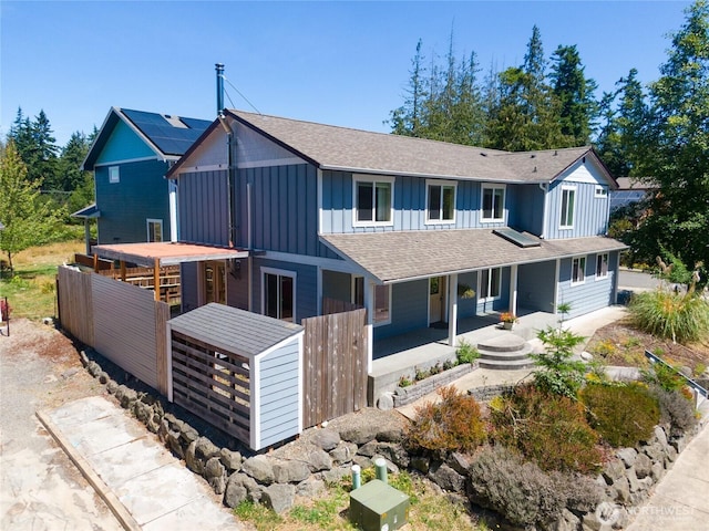 408 Eddy Ct, Port Townsend, WA 98368 - view of front of home featuring board and batten siding, a porch, and roof with shingles