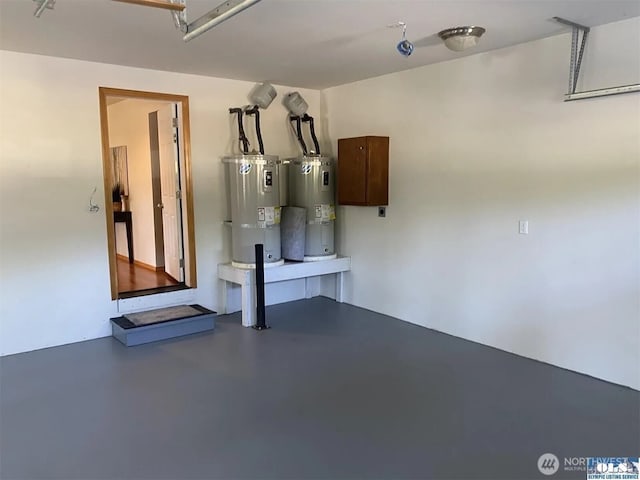 408 Eddy Ct, Port Townsend, WA 98368 - garage featuring strapped water heater and electric water heater